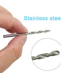 Hand holding a 0.8mm stainless steel drill bit from Rock Solid Aluminum Hand Pin Vise Kit Hella Tough.