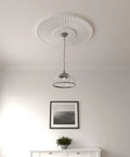 36 And One Quarter Inch Outside Diameter Ceiling Medallion With One Seven Eighths Inch Projection Fits Canopies Up To Six And A Quarter Inch Lightweight For Quick Install Dope Detailing Prime Ready For Paint Or Faux Finish installed around a pendant light in a modern room.