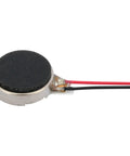 Close-up of a flat coin vibration motor from a Twenty Five Pack Mini Vibration Motors 3V 12000 RPM Flat Coin Button Dope Vibe Motors For Mobile Devices.