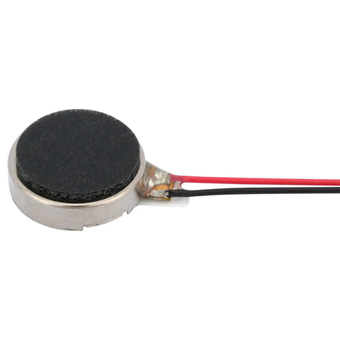 Close-up of a flat coin vibration motor from a Twenty Five Pack Mini Vibration Motors 3V 12000 RPM Flat Coin Button Dope Vibe Motors For Mobile Devices.