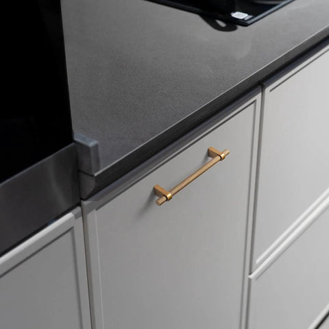 Installation of Six Pack 5 Inch Center To Center Knurled Antique Brass Cabinet Bar Handles with Blocky Triangular Mounts on kitchen drawer