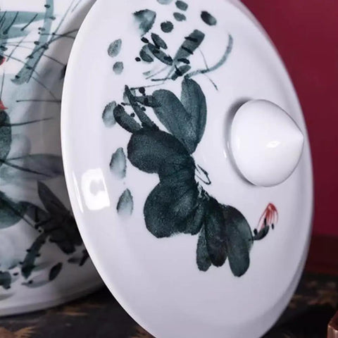 Lid of retro ceramic rice dispenser featuring floral design and smooth finish, enhancing kitchen decor. Makes Your Kitchen Vibe Level Up With This Retro Ceramic Rice Dispenser That Traps Freshness For Flour Sugar And Coffee Beans Using A Dead On Airtight Seal And Trendy Tassel Handle Massive 25kg Canister.