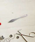 Straight Up Precision Leather Marking Divider And Adjustable Stainless Steel Wing Creaser on a wooden table with sewing tools.