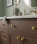 Kick Up Your Kitchen Game With These Solid Modern Brushed Brass Cabinet Knobs Perfect For Drawers And Cupboards Snag This Top Tier 10 Pack Hardware Set For A Fresh Upgrade. Brushed brass cabinet knobs on a dark wooden bathroom vanity.