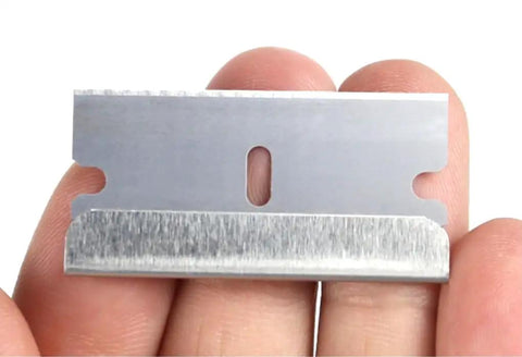 Single Edge Razor Blades 10 Pack For Straight Edge Razors And Scrapers Heavy Duty Refills SK5 Steel blade held by fingers
