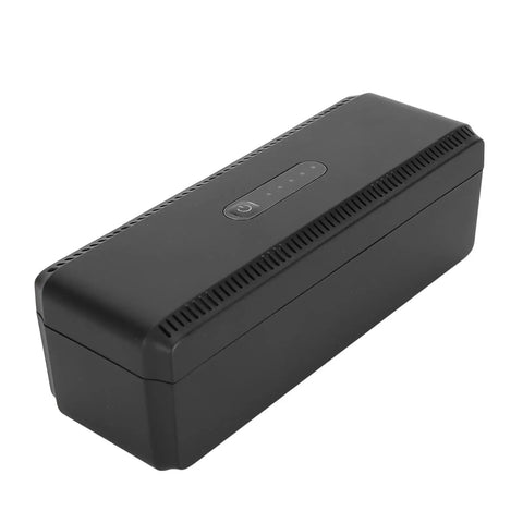 Check Out This Awesome UPS Battery Backup That Gives You Reliable 10400mAh Of Backup Power In A Pinch And Also Serves As A Go To USB Power Bank With 18W Of Multi Output Juice For Your Devices Using The US Plug, shown from an angled view.