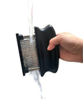 Meat Tenderizer With 48 Stainless Steel Needle Blades Heavy Duty Pro Grade Kitchen Tool being washed under running water