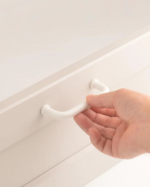 Person installing Five Pack White Modern Cabinet Pulls Drawer Handles With Three And Three Quarters Inch Hole Centers 96mm Aluminum Alloy