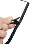 Close-up of hand holding Listen Only 3.5mm Earpiece With C Shape Ear Hook For Security Police Ham Radio And Walkie Talkie