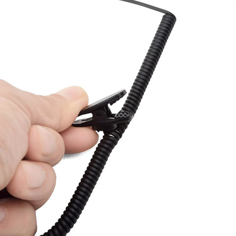 Close-up of hand holding Listen Only 3.5mm Earpiece With C Shape Ear Hook For Security Police Ham Radio And Walkie Talkie