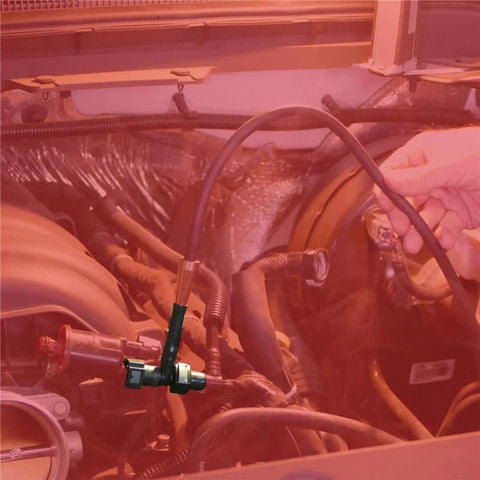 Redline Detection EasyConnect EVAP leak-detection probe connected to engine bay with black hose and metal fitting