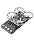 65 Pro Drone Frame With 66mm Wheelbase, 3in1 HD Flight Controller, 0802SE Motors on digital scale, beefed up PP composite