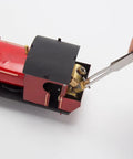 Detail of 1/50 HO Live Steam Locomotive Model With Oscillating Steam Engine Kit for adults being assembled with tweezers.