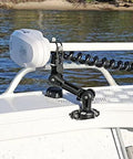 Railblaza trolling motor support XL mounted on boat bow with adjustable arm and tool-free locking strap.
