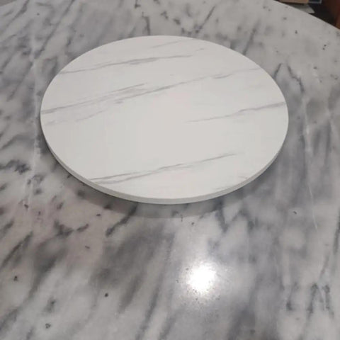 50 Inch White Wooden Lazy Susan Turntable For Kitchen, smooth surface with marble-like design on a gray table.