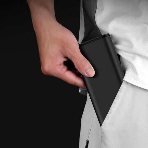 Man placing 24-In-1 Precision Screwdriver Set For Quick Fixes: A Go-To Handy Mini Tool Kit in pocket, showcasing portability.