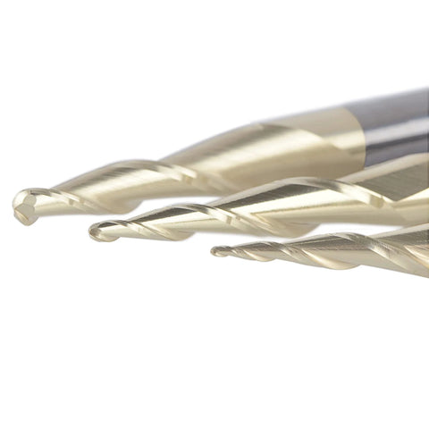 Three SpeTool carbide ball-nose router bits with spiral flutes, close-up view