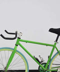 Green bike with Bullhorn Aluminum Alloy Handlebar 25.4mm By 390mm for fixed gear and road bikes, featuring 6061 aluminum bar.