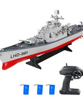 Dope RC Warship Battleship For Lakes And Rivers 1:390 Scale Remote Control Boat With 2.4GHz Control, shown with remote and batteries