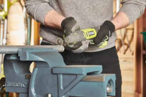 User handling the Smooth Operator 12 Volt Cordless Rotary Tool Featuring Variable Speed Up To 35000 RPM for precision work.