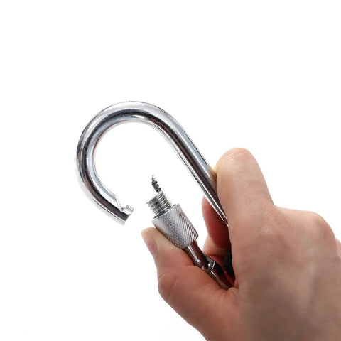 Hand holding carabiner from 10mm Static Rock Climbing Rope 35ft With Carabiner For Outdoor Safety And Climbing Adventures, A Real Workhorse