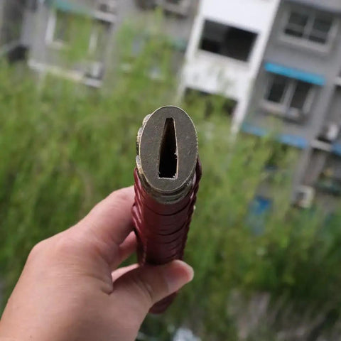 Close-up of top view of Dope Japanese Samurai Katana Tsuka Handle Ten Point Two Inch DIY Replacement with alloy fittings.