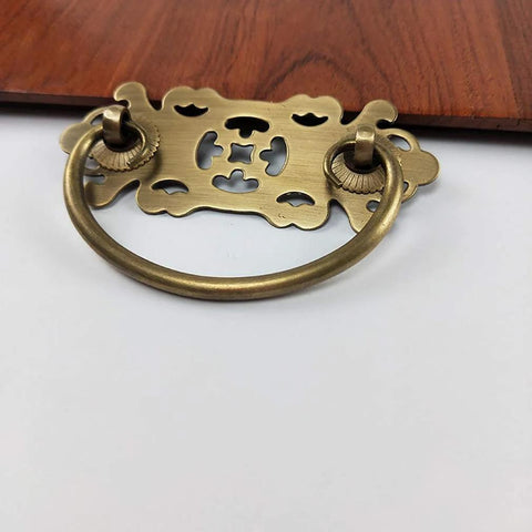 Antique Brass Vintage Style Pull Handles Set for Bookcases and Wardrobes, shown installed on 22mm wood drawer