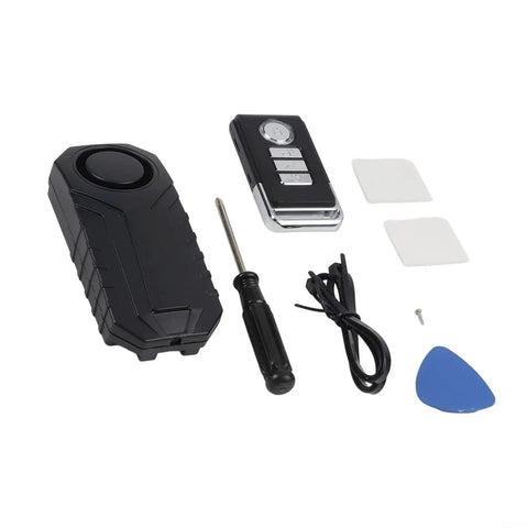 Lock Down Your Ride With This Slick 113dB Wireless Bike Alarm, Featuring A Hype Beating Vibration Sensor That Screams At Thieves And Lets You Control It Remotely From 66 Feet Away In Total Black Style., wireless bike alarm kit with remote, screwdriver, cable, and adhesive pads