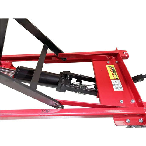 Side view of red steel-frame scissor lift table cart with hydraulic cylinder