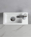 Top view of compact wall hung powder room basin for small bathrooms, rectangular ceramic wash basin with right hand drain.