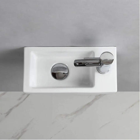 Top view of compact wall hung powder room basin for small bathrooms, rectangular ceramic wash basin with right hand drain.