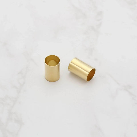Two brass pot sleeves for guitar split-shaft pots, 6.35 mm OD, 6.04 mm ID