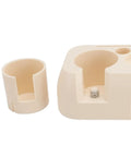 Heavy Duty Abs Coffee Tamper Station Built Tough For The Daily Grind with a portafilter holder and small cup.