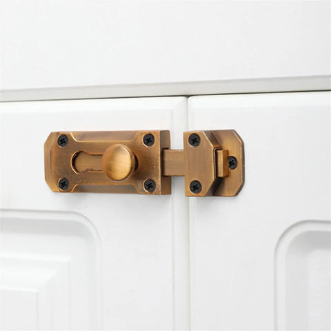 Door Window Gate Garage Security Snap Lock Sliding Bolt Zinc Alloy Buckle on a white cabinet door.