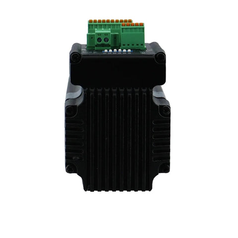 Front view of Nema23 integrated stepper motor with driver, black finned housing and green terminal block on top.
