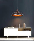 Industrial Nautical Barn Pendant Light With Rustic Bowl Shape Ceiling Fixture On Chain above cabinet, rust finish, interior scene.