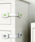 Childproof Cabinet Locks 4 Pack With Adhesive Backing Safe Green ABS And PE Straps for easy installation on drawers.