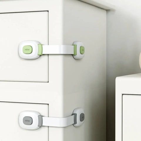 Childproof Cabinet Locks 4 Pack With Adhesive Backing Safe Green ABS And PE Straps for easy installation on drawers.