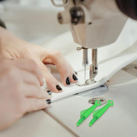 Hands threading a sewing machine with Fish Mouth Sewing Machine Needle Threader 2024 Upgrade Self Threading Tool in green, pack of 10 visible.