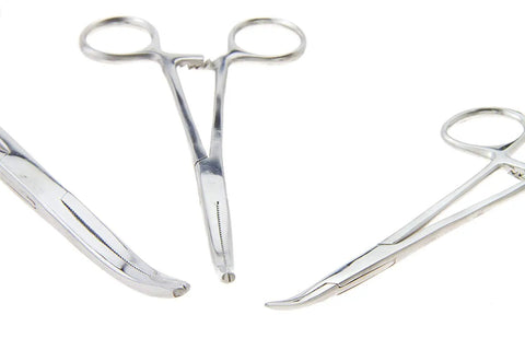 Close-up of Go To Workhorse Hemostat Forceps Set in stainless steel, featuring straight and curved locking clamps for various uses.