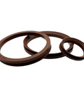 Real Deal Fkm Fluororubber Rotary Shaft Seal With Rock Solid O Ring Cuff Engineered To Halt Drips And Grease On Va Series Machinery Built Tough For Daily Grind, three sizes of brown seals shown.