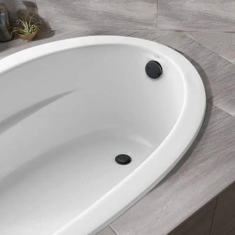 Tip‑Toe Bathtub Drain Stopper Set, Brass ABS Construction for Standard Tub Drains in a white bathtub with black stopper.