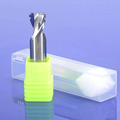 Front view of neon-green CNC router bit with tungsten carbide end mill beside a transparent plastic case.