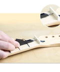 Pro Level Guitar Nut Scribe Tool And Dead On Saddle Height Marker For Acoustic Classical Repairs Durable Aluminum And Brass Build Black Grip in use on guitar fretboard