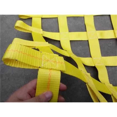 Close-up of Rock Solid Heavy Duty Lifting Sling Net With Rugged Nylon Webbing, showing yellow straps for secure towing.