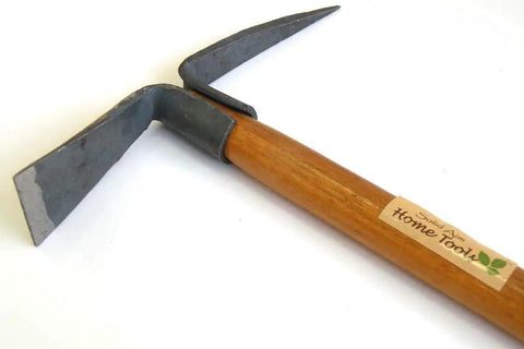 Close-up of Ergonomic Camp Heavy Duty Pick Mattock with Forged Railroad Track Steel head and wooden handle.