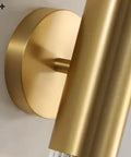 Close-up of wall sconce light features brushed brass mount and copper finish, suitable for bedroom or hallway.