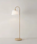 52 Inch Floor Lamp With Faux Wood Finish And White Pattern Shade Japandi Style Adjustable Arm On Off Rotary Switch Socket For Easy Operation Ideal Modern Living Room Light in a minimalist setting