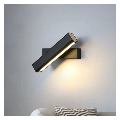 Elevate Your Home Vibe With This Sleek Black Metal Swivel Wall Sconce Led Lighting For Bedroom Living Room And Hallways Rustproof Adjustable Accent Lamp mounted on gray wall with soft glow.