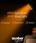 Giftable Amber Book Light With Blue Light Blocking Rechargeable 1600K Warm Amber Glow shown clipped to an e-reader